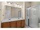 Bathroom with double sink vanity, glass enclosed shower, and large mirror at 6244 Catalina Dr. # 511, North Myrtle Beach, SC 29582