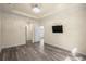An open bedroom showing the flooring, television, and entryways at 6244 Catalina Dr. # 511, North Myrtle Beach, SC 29582