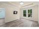 An open bedroom showing off the flooring and the light from the large windows at 6244 Catalina Dr. # 511, North Myrtle Beach, SC 29582