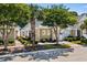 Street view of well-maintained single-story home with landscaping and mature trees at 6244 Catalina Dr. # 511, North Myrtle Beach, SC 29582