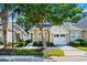Beautiful tan home with a front yard, bushes, and a 1 car garage at 6244 Catalina Dr. # 511, North Myrtle Beach, SC 29582