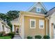 View of a tan house with white trim and a well-maintained lawn at 6244 Catalina Dr. # 511, North Myrtle Beach, SC 29582
