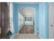 Bright foyer with wood floors, pale blue walls, and an arched doorway leading into the living area at 6244 Catalina Dr. # 511, North Myrtle Beach, SC 29582