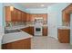 Kitchen shows matching appliances, cabinets, and countertops with mosaic tile backsplash at 6244 Catalina Dr. # 511, North Myrtle Beach, SC 29582