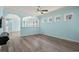 Living room with wood floors, bright paint and open floor plan allowing views of the kitchen at 6244 Catalina Dr. # 511, North Myrtle Beach, SC 29582