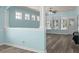 Spacious living area with modern wood floors, soft blue walls, and multiple windows at 6244 Catalina Dr. # 511, North Myrtle Beach, SC 29582