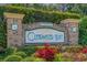 Clearwater Bay community sign surrounded by beautiful landscaping and flowers at 6244 Catalina Dr. # 511, North Myrtle Beach, SC 29582
