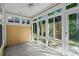 Bright sunroom features large windows and a ceiling fan, perfect for enjoying natural light and outdoor views at 6244 Catalina Dr. # 511, North Myrtle Beach, SC 29582