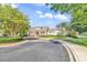 Exterior shot of well-maintained community clubhouse with welcoming entrance, manicured landscaping, and parking at 67 Camden Circle, Pawleys Island, SC 29585