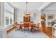 Bright dining room with hardwood floors, complemented by large windows and natural light at 67 Camden Circle, Pawleys Island, SC 29585