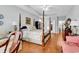 Spacious primary bedroom featuring a four poster bed, hardwood floors, and ample natural light at 67 Camden Circle, Pawleys Island, SC 29585