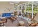 Beautiful sunroom with ample seating, stylish furniture, and scenic views of the outdoors at 67 Camden Circle, Pawleys Island, SC 29585