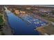 Aerial view of the marina featuring a variety of boats, beautiful blue water, and city views at 7202 Seville Dr., Myrtle Beach, SC 29572