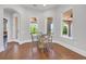 Bright breakfast nook featuring large windows with outdoor views, complemented by a classic dining set at 7202 Seville Dr., Myrtle Beach, SC 29572