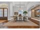 Spacious formal dining room featuring a grand chandelier and decorative artwork at 7202 Seville Dr., Myrtle Beach, SC 29572