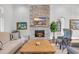 Living room featuring a stone fireplace, a large flat screen TV, and a wooden mantle at 7202 Seville Dr., Myrtle Beach, SC 29572