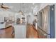 Open kitchen with stainless steel appliances, granite countertops, a large island, and seamless access to the living area at 7202 Seville Dr., Myrtle Beach, SC 29572