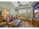 Inviting living room with hardwood floors, ceiling fan, and comfortable seating at 7202 Seville Dr., Myrtle Beach, SC 29572