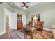Comfortable living room space with hardwood floors, large ottoman and area rug at 7202 Seville Dr., Myrtle Beach, SC 29572