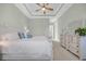Tranquil primary bedroom showcasing neutral tones, tray ceiling, and elegant furnishings at 7202 Seville Dr., Myrtle Beach, SC 29572