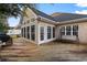 Spacious back deck perfect for outdoor entertaining, featuring a swing and access to the sunroom at 728 Churchill Dr., Myrtle Beach, SC 29579