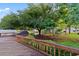 Enjoy outdoor living with a large deck overlooking a lush backyard and serene pond at 728 Churchill Dr., Myrtle Beach, SC 29579