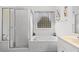 Bright bathroom features a jetted tub, glass block window, and separate shower at 728 Churchill Dr., Myrtle Beach, SC 29579