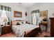 Charming bedroom with wood furniture, floral curtains, and coordinating decor accents at 728 Churchill Dr., Myrtle Beach, SC 29579