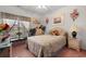Cozy bedroom with floral decor, a ceiling fan, and natural light from the window at 728 Churchill Dr., Myrtle Beach, SC 29579