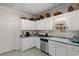 Functional kitchen featuring stainless steel appliances and white cabinetry at 728 Churchill Dr., Myrtle Beach, SC 29579