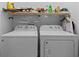 The laundry room is equipped with a side-by-side washer and dryer at 728 Churchill Dr., Myrtle Beach, SC 29579