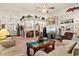 Open living room with a ceiling fan, TV, and dining area at 728 Churchill Dr., Myrtle Beach, SC 29579