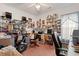 This cluttered home office features multiple desks and storage shelves at 728 Churchill Dr., Myrtle Beach, SC 29579
