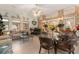 Bright sunroom with brick accents, comfortable seating, and a glass dining table at 728 Churchill Dr., Myrtle Beach, SC 29579