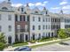 Beautiful townhomes with brick and white exteriors, landscaped lawns, and a common area at 815 Murray Ave., Myrtle Beach, SC 29577