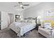Cozy bedroom featuring a ceiling fan, bedside tables with lamps, and beach themed linens at 815 Murray Ave., Myrtle Beach, SC 29577
