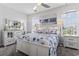 Light and airy bedroom with white furniture, decorative bedding, and lots of natural light at 815 Murray Ave., Myrtle Beach, SC 29577