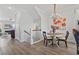 Bright dining area with wainscoting, chandelier, and artwork at 815 Murray Ave., Myrtle Beach, SC 29577