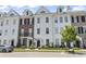 Attractive townhomes with a mix of brick and white siding, dormer windows, and well-kept landscaping at 815 Murray Ave., Myrtle Beach, SC 29577