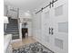 Cozy foyer with a modern barn door, decorative accents, and a staircase at 815 Murray Ave., Myrtle Beach, SC 29577