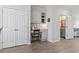Charming home office nook with built-in desk, storage, and natural light with view to renovated bathroom at 815 Murray Ave., Myrtle Beach, SC 29577