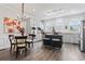 Bright kitchen features white cabinets, granite countertops, stainless steel appliances, and a breakfast bar at 815 Murray Ave., Myrtle Beach, SC 29577