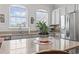 Bright kitchen features granite counters, stainless appliances, white cabinets, and sunny windows at 815 Murray Ave., Myrtle Beach, SC 29577