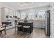 Bright kitchen features granite countertops, stainless steel appliances, white cabinets and breakfast bar at 815 Murray Ave., Myrtle Beach, SC 29577