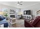 Inviting living room with a cozy fireplace, ceiling fan, and plenty of natural light at 815 Murray Ave., Myrtle Beach, SC 29577