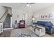 Spacious living room featuring a staircase, stylish decor, and comfortable seating at 815 Murray Ave., Myrtle Beach, SC 29577