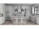 Modern kitchen featuring white cabinets, stainless steel appliances, a center island, and pendant lighting at 9 Sw Mashie Ct., Carolina Shores, NC 28467