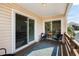Covered balcony with a cozy seating area, offering a private outdoor space with neighborhood views at 9679 Stillwater Ct., Myrtle Beach, SC 29572