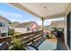 Relaxing balcony with outdoor seating, charming string lights, and a view of the surrounding community at 9679 Stillwater Ct., Myrtle Beach, SC 29572