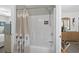 Neutral bathroom with a shower-tub combination and shower curtain and access to the Primary bedroom at 9679 Stillwater Ct., Myrtle Beach, SC 29572
